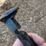 Bottle opener made from a railroad nail or spike.