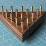 IQ Puzzle made out of walnut with brass pegs