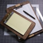 A walnut and maple clipboard made from scrap wood.